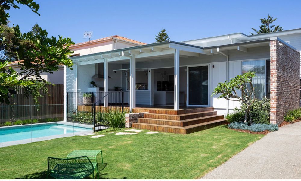 A House With a Swimming Pool in Front of It — QBC Constructions In Pacific Avenue, QLD