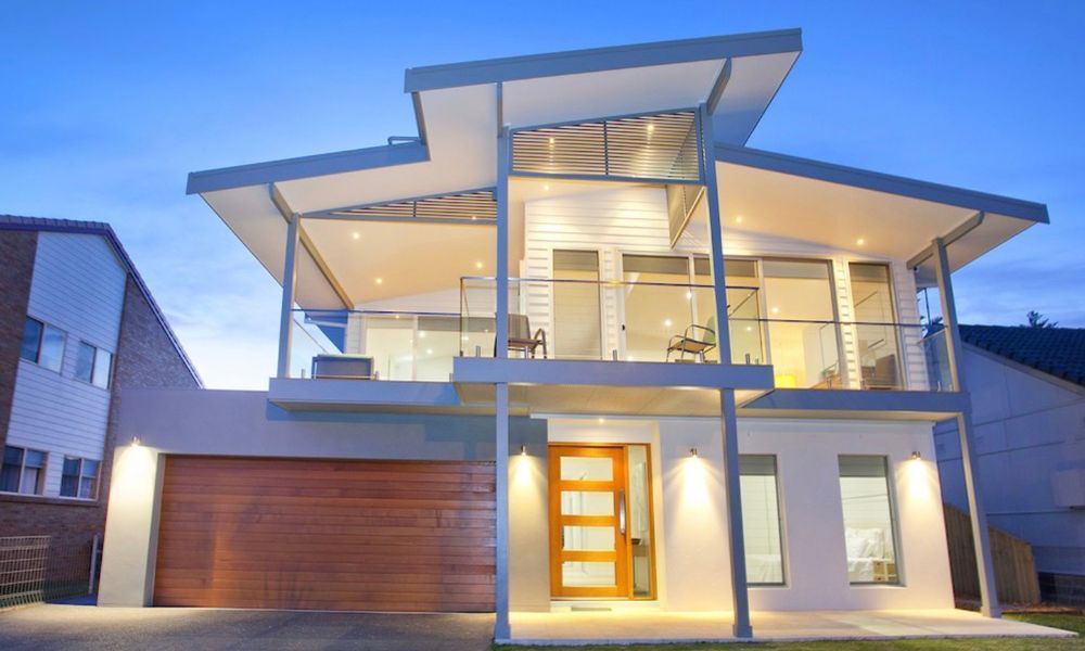A Modern House With a Lot of Windows — QBC Constructions In Werri Beach, NSW