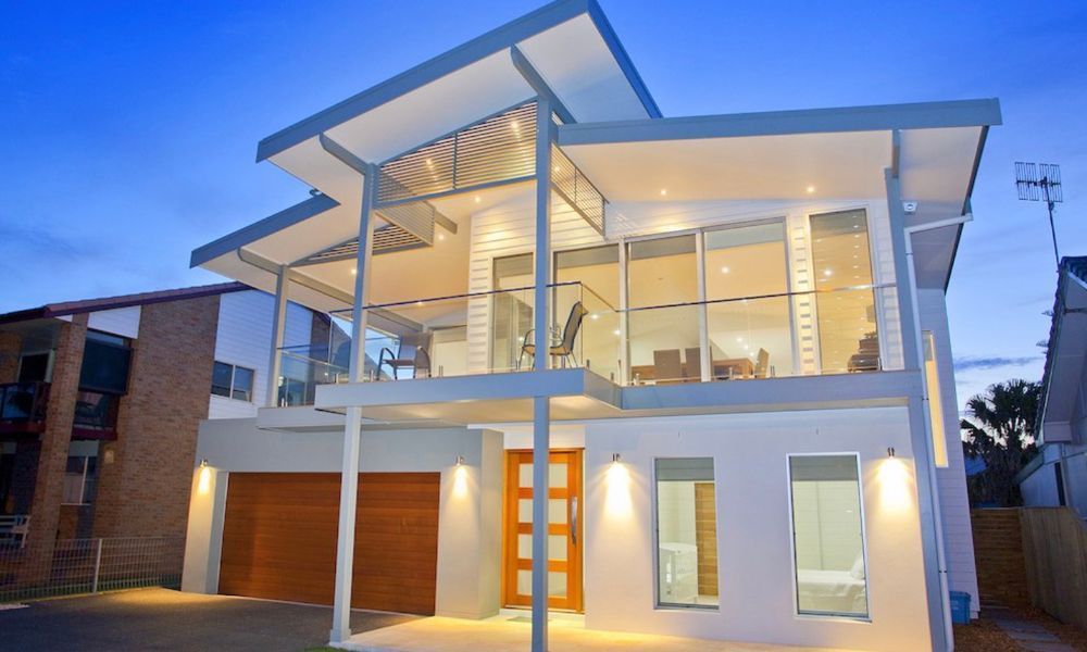 A Large White House With a Lot of Windows — QBC Constructions In Werri Beach, NSW