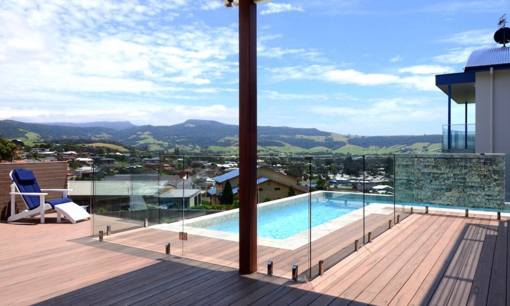 A Deck With a View of a Swimming Pool and Mountains — QBC Constructions In Gerringong, NSW