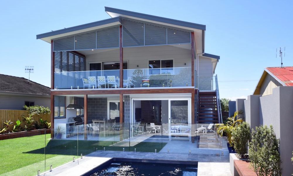 A Large House With a Swimming Pool in the Backyard — QBC Constructions In Gerringong, NSW