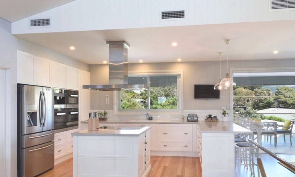 A Kitchen With White Cabinets , Stainless Steel Appliances — QBC Constructions In Gerringong, NSW