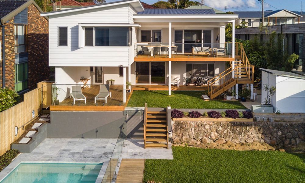 An Aerial View of a House With a Swimming Pool in the Backyard — QBC Constructions In Gerringong, NSW