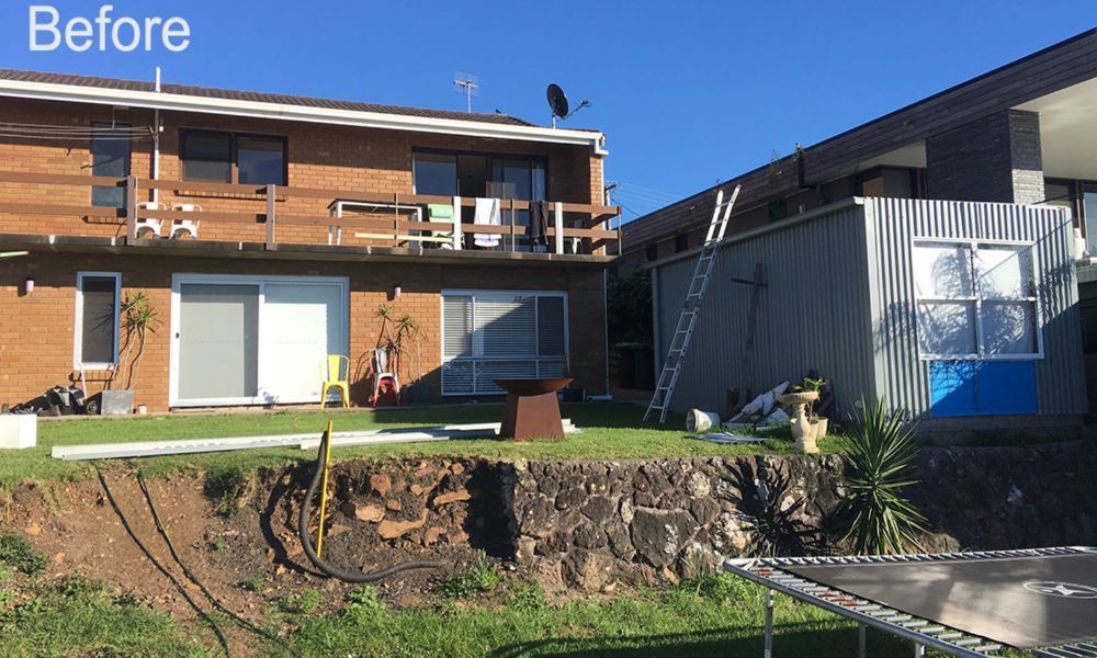 A Before Picture of a House With a Trampoline in Front of It — QBC Constructions In Gerringong, NSW
