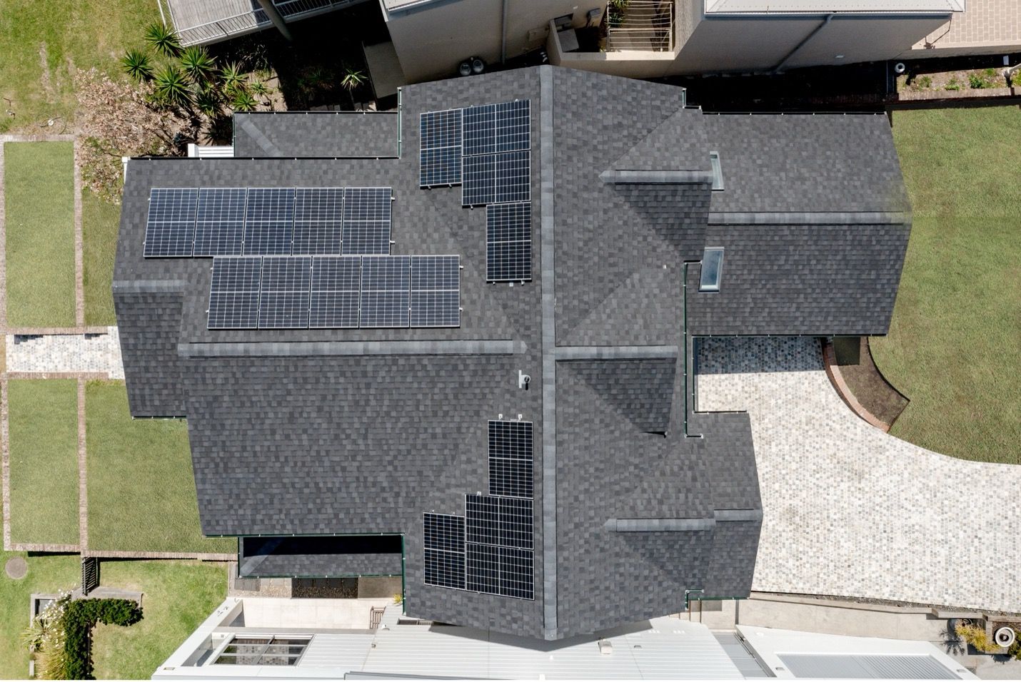 An Aerial View of a House With Solar Panels on the Roof — QBC Constructions In Gables, NSW