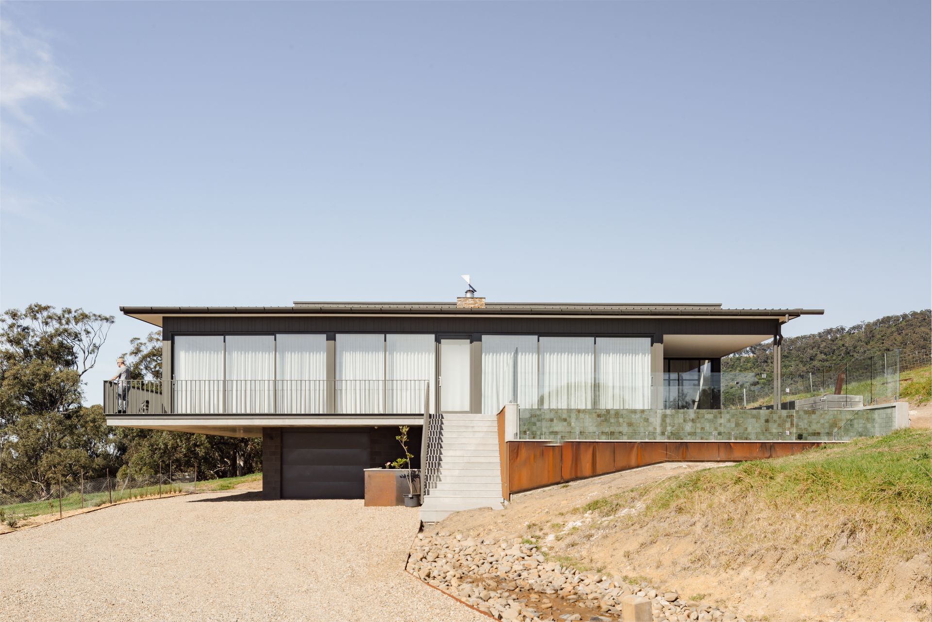 A Large House With a Lot of Windows — QBC Constructions In Seven Mile Beach, NSW