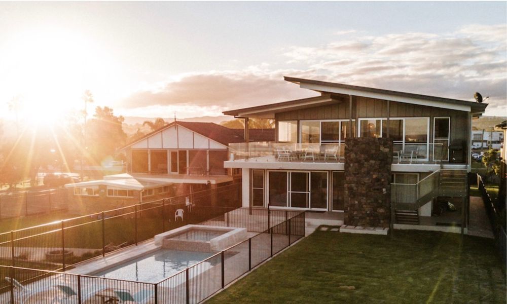 A Large House With a Swimming Pool in the Backyard — QBC Constructions In Shellharbour, NSW
