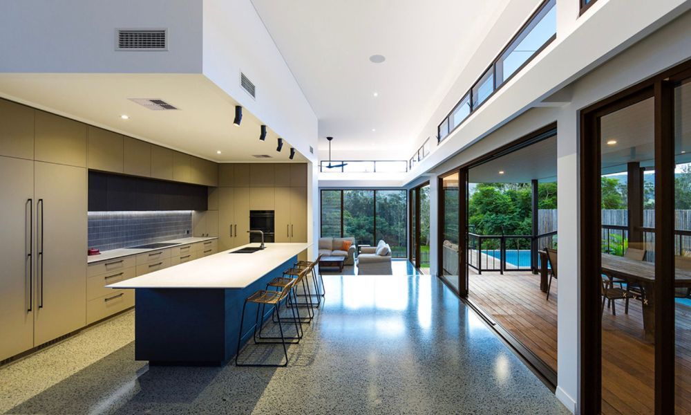 A Kitchen With a Large Island in the Middle of It — QBC Constructions In South Coast, NSW