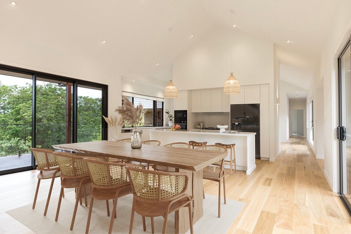 A Dining Room With a Table and Chairs — QBC Constructions In Curramore, Queensland