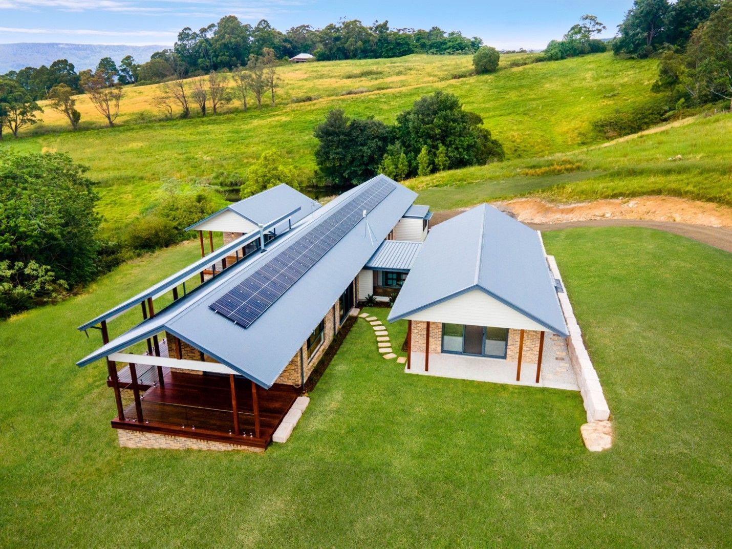 An Aerial View of a House With Solar Panels — QBC Constructions In Curramore, Queensland