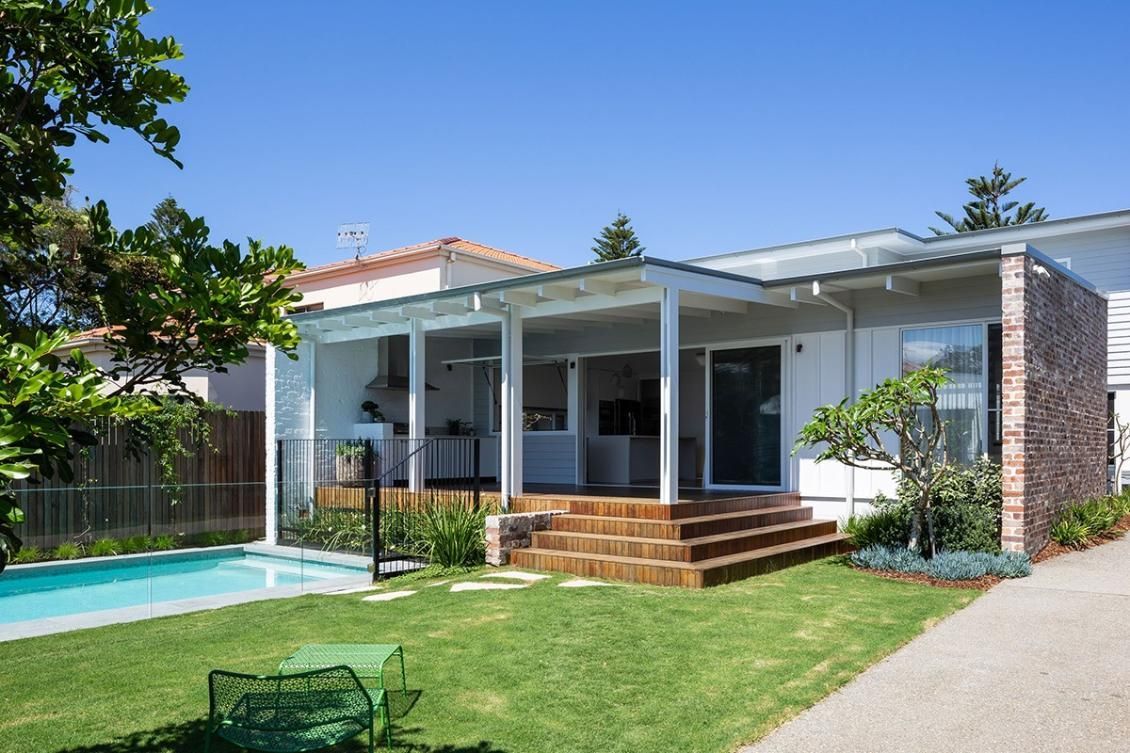 A White House With A Swimming Pool In The Backyard — QBC Constructions In Berry, NSW