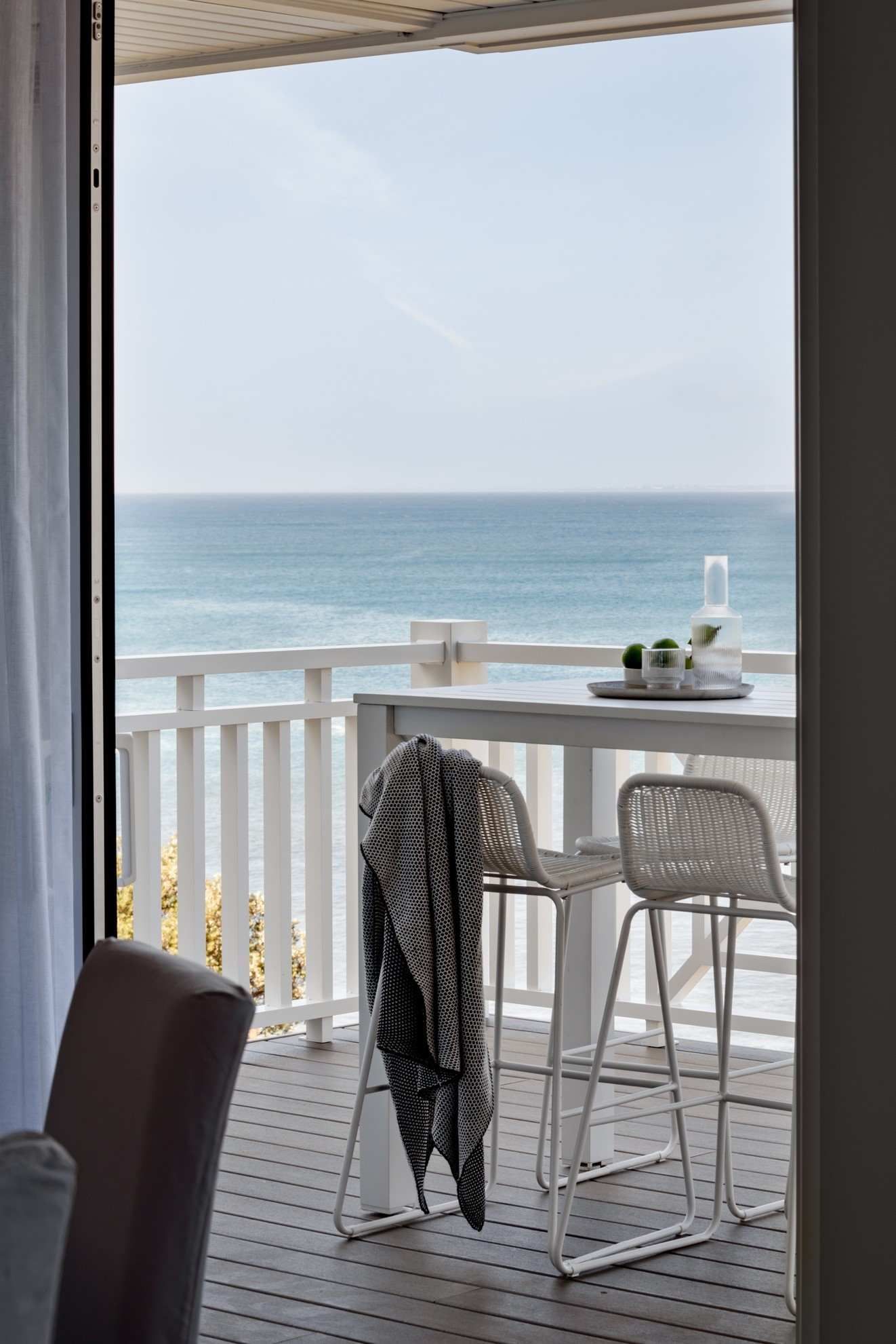 A Balcony With a Table and Chairs — QBC Constructions In Gables, NSW