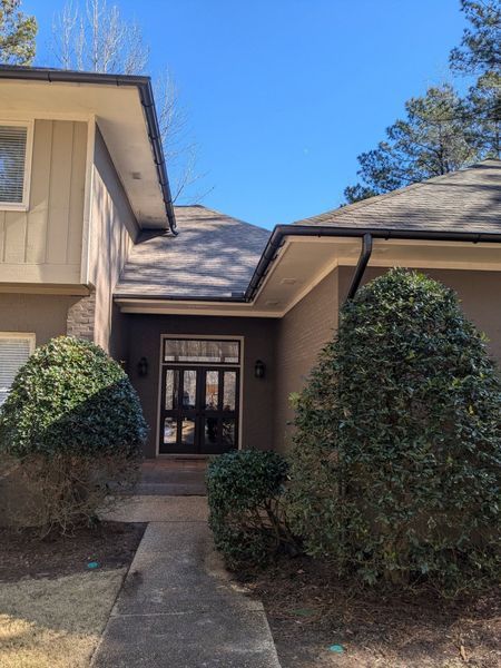 A house with a walkway leading to the front door