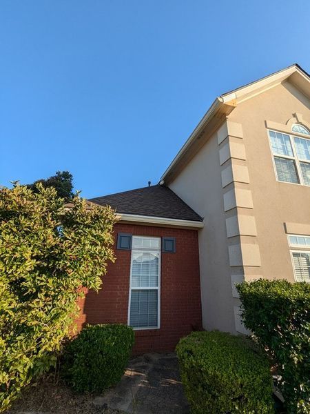 A house with a roof that has a gutter on it