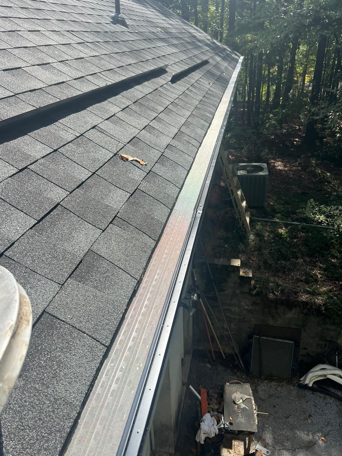 A Close Up of a Roof With a Gutter on It