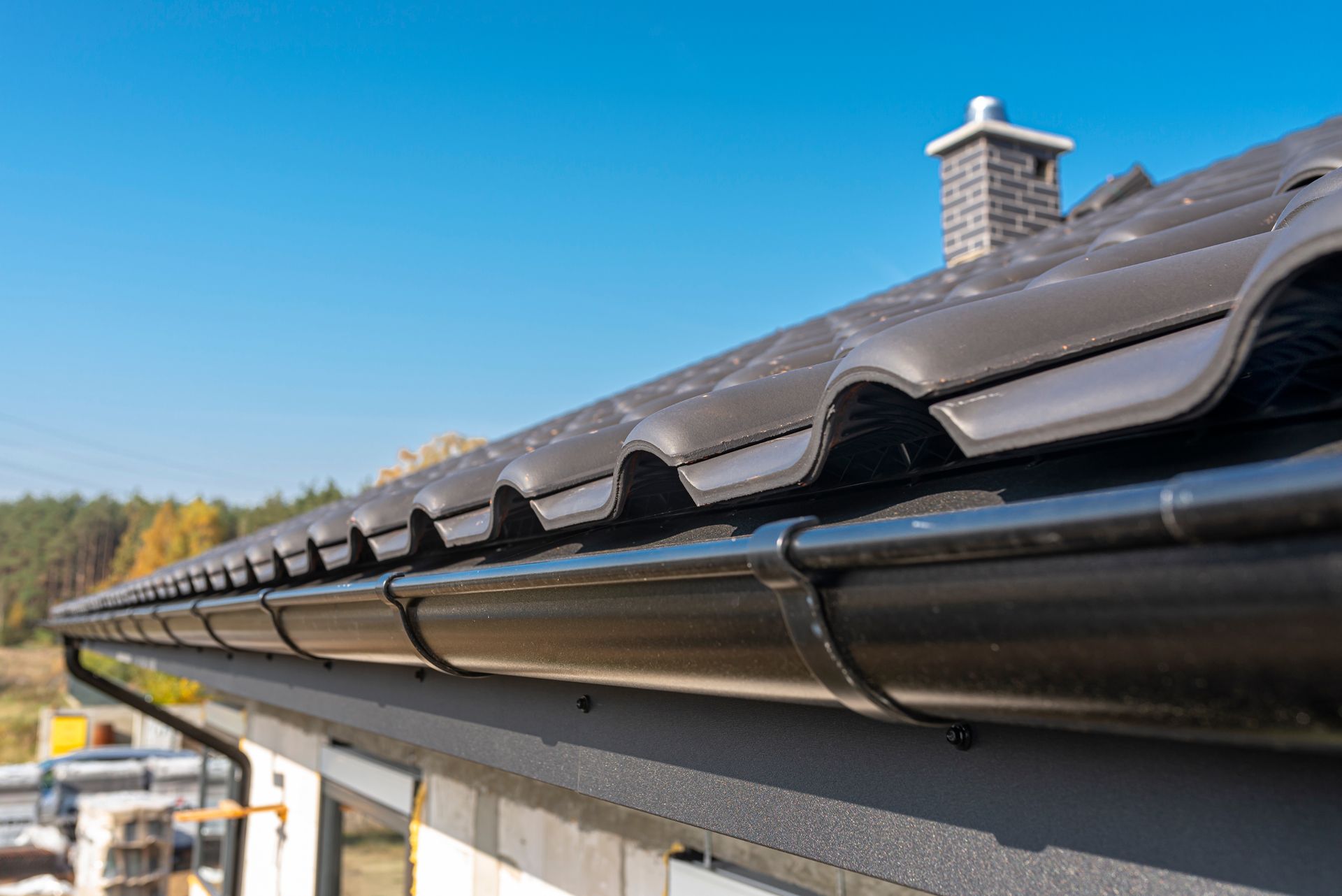 A Close Up of a Gutter on the Roof of a House