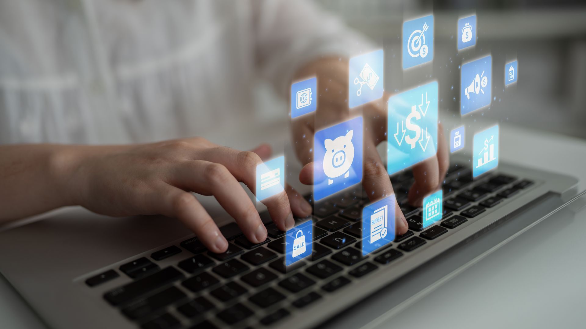 Person using a laptop, reviewing data, and analyzing charts at a desk in a bright office. Person using a laptop, reviewing data, and analyzing charts at a desk in a bright office.