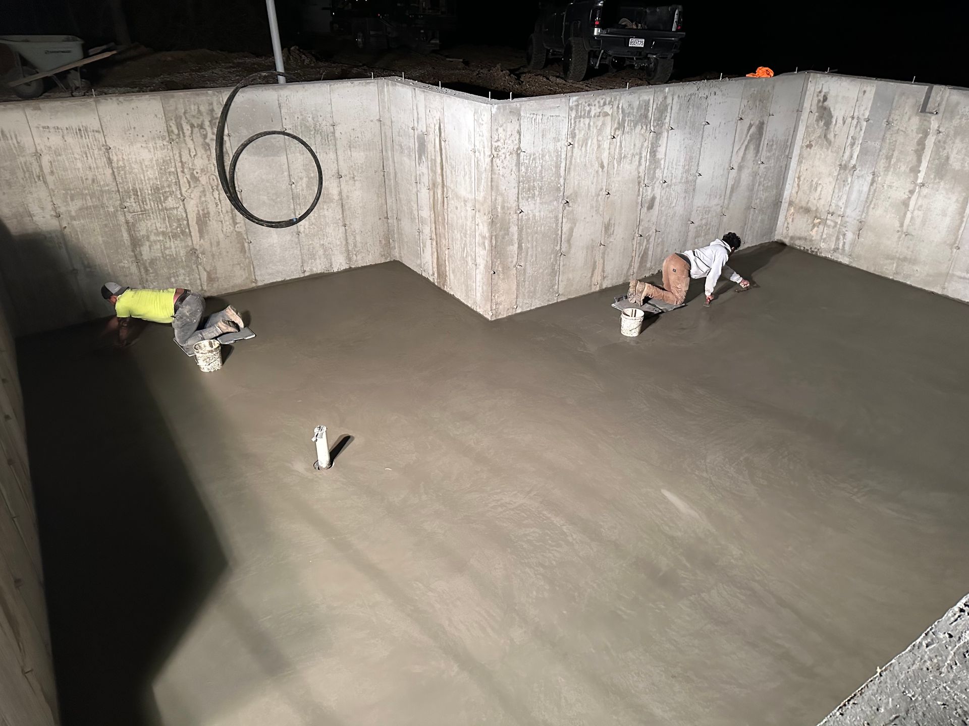 A Concrete Floor Is Being Built On A Construction Site — St. Charles, MO — TC Concrete Services