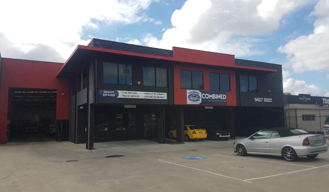 Damaged red car at the back of a tow truck | Perth, WA | Combined Car & Truck Smash