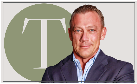 Man in a suit smiles, green circle with 