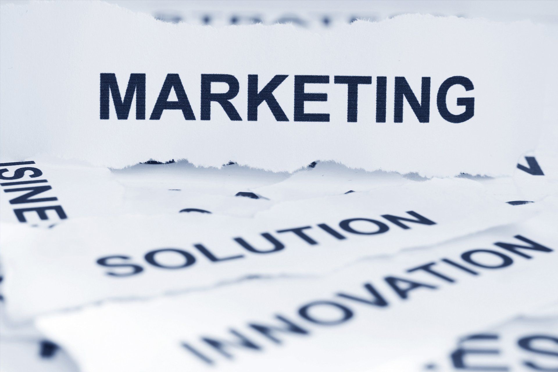 The word marketing is on a piece of paper