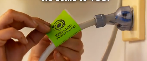 A person attaching a green 