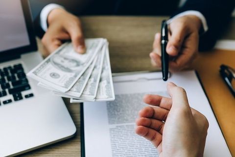 Man Handling the Cash and a Pen— Elizabethton, TN — Southern Finance