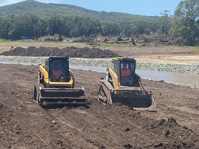 Two Backhoe Loader Truck Clearing the Area — Seaview Excavations in Hallidays Point, NSW