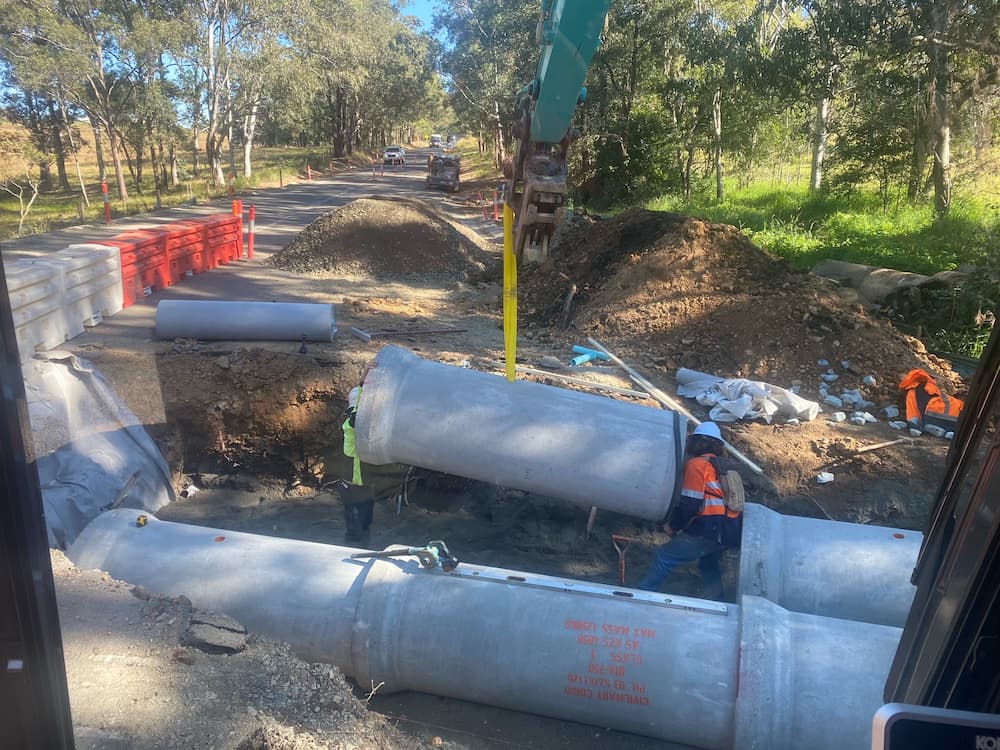 Construction Workers Installing Culvert in the Roadway — Seaview Excavations in Hallidays Point, NSW