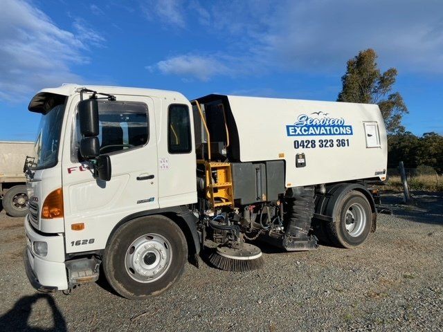 Truck Cleaning a Tiles on a Street — Seaview Excavations in Hallidays Point, NSW