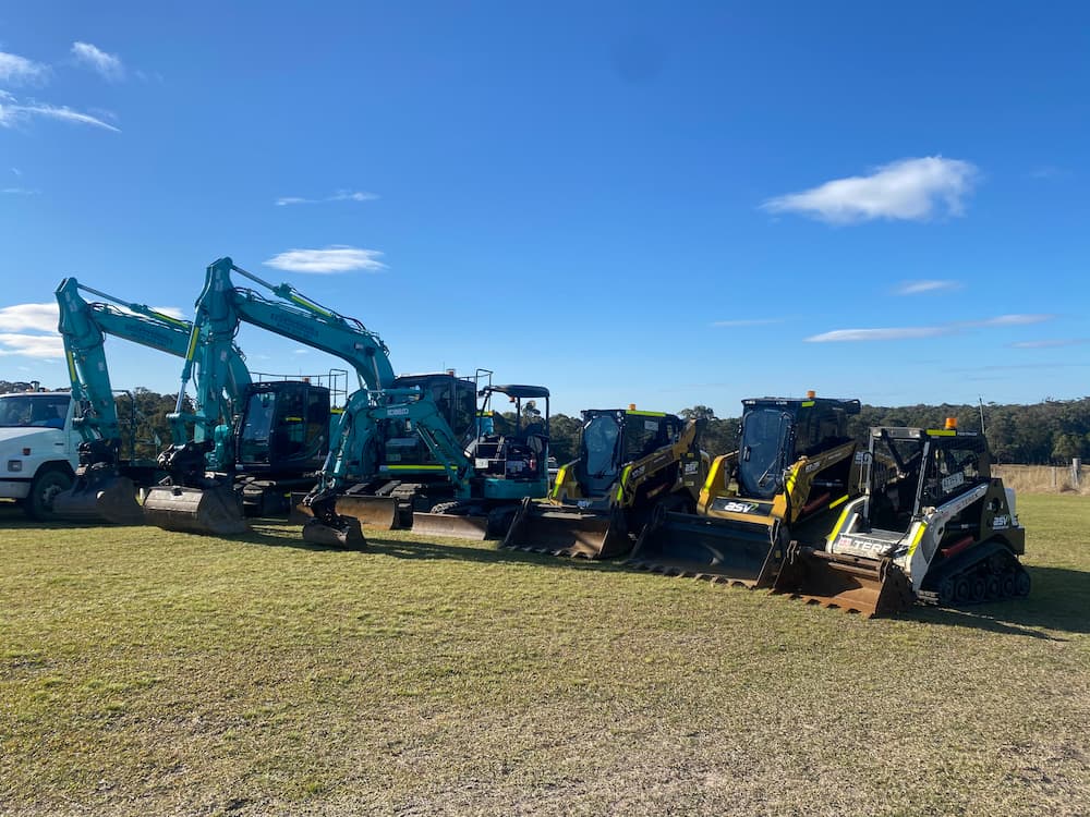 Fleet of Heavy Equipment in Open Field — Seaview Excavations in Hallidays Point, NSW