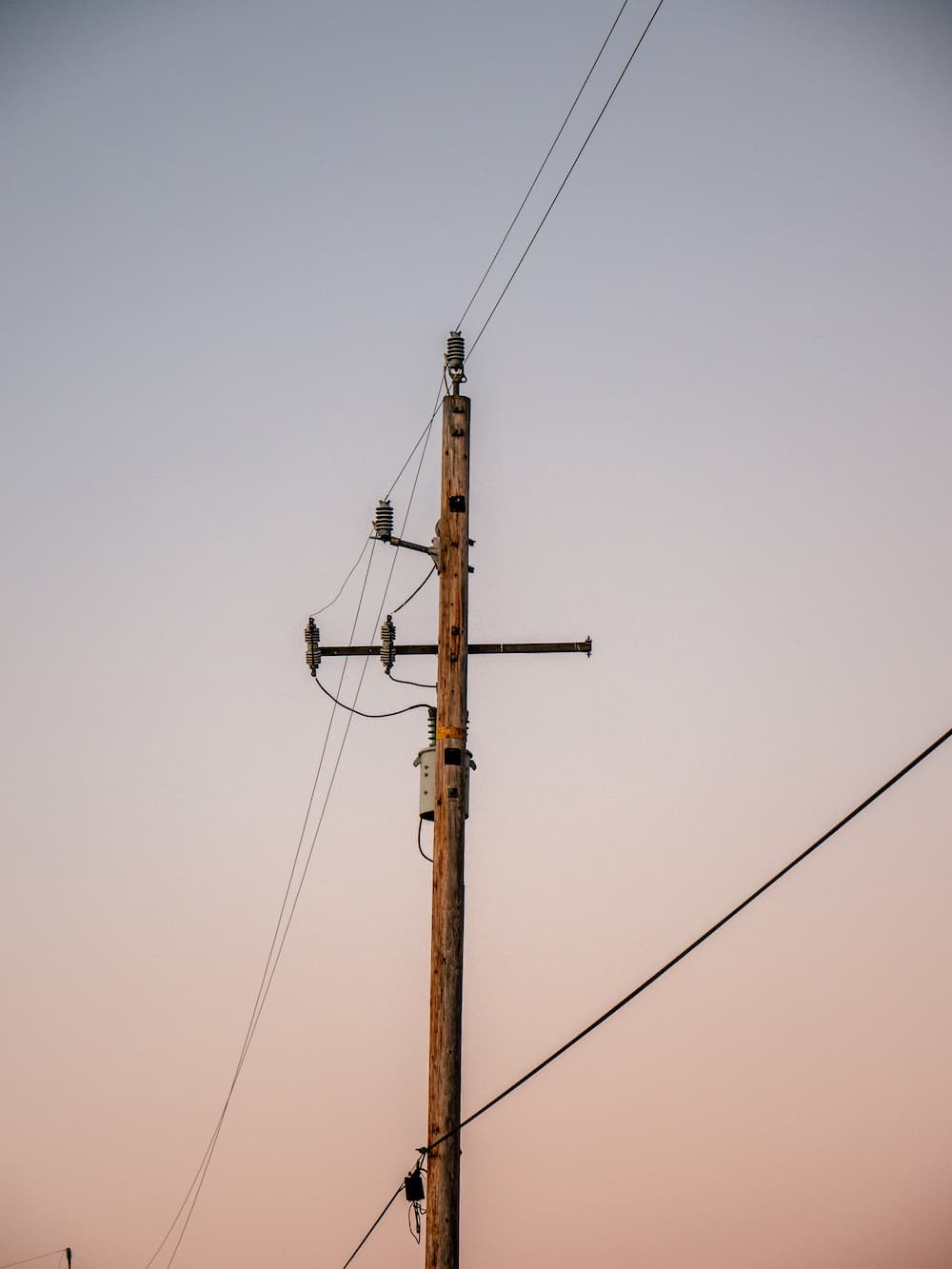 Electric Pole in Orange Sky Background — Seaview Excavations in Hallidays Point, NSW