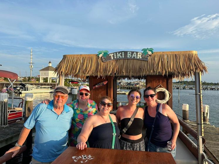 happy family on ohana tiki boat