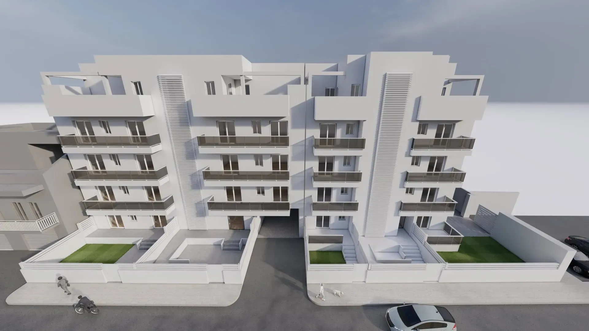 Una veduta aerea di un edificio con un'auto parcheggiata davanti