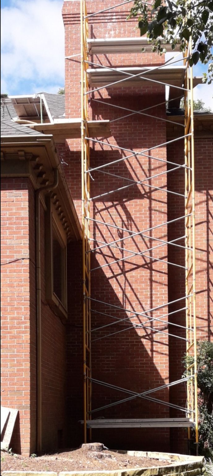 Typical Rooftop Chimney with a Rain Cap and Shielding – Evansville, IN – Pro Chimney Service