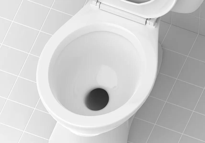 White toilet bowl, open lid, with a dark hole inside, set on light gray tiled floor.