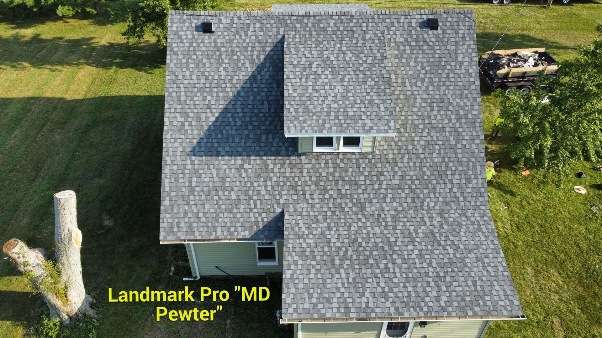 Aerial view of a residential house roof with gray Landmark Pro 