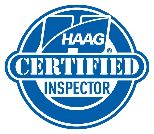 Blue and white circular emblem with the text