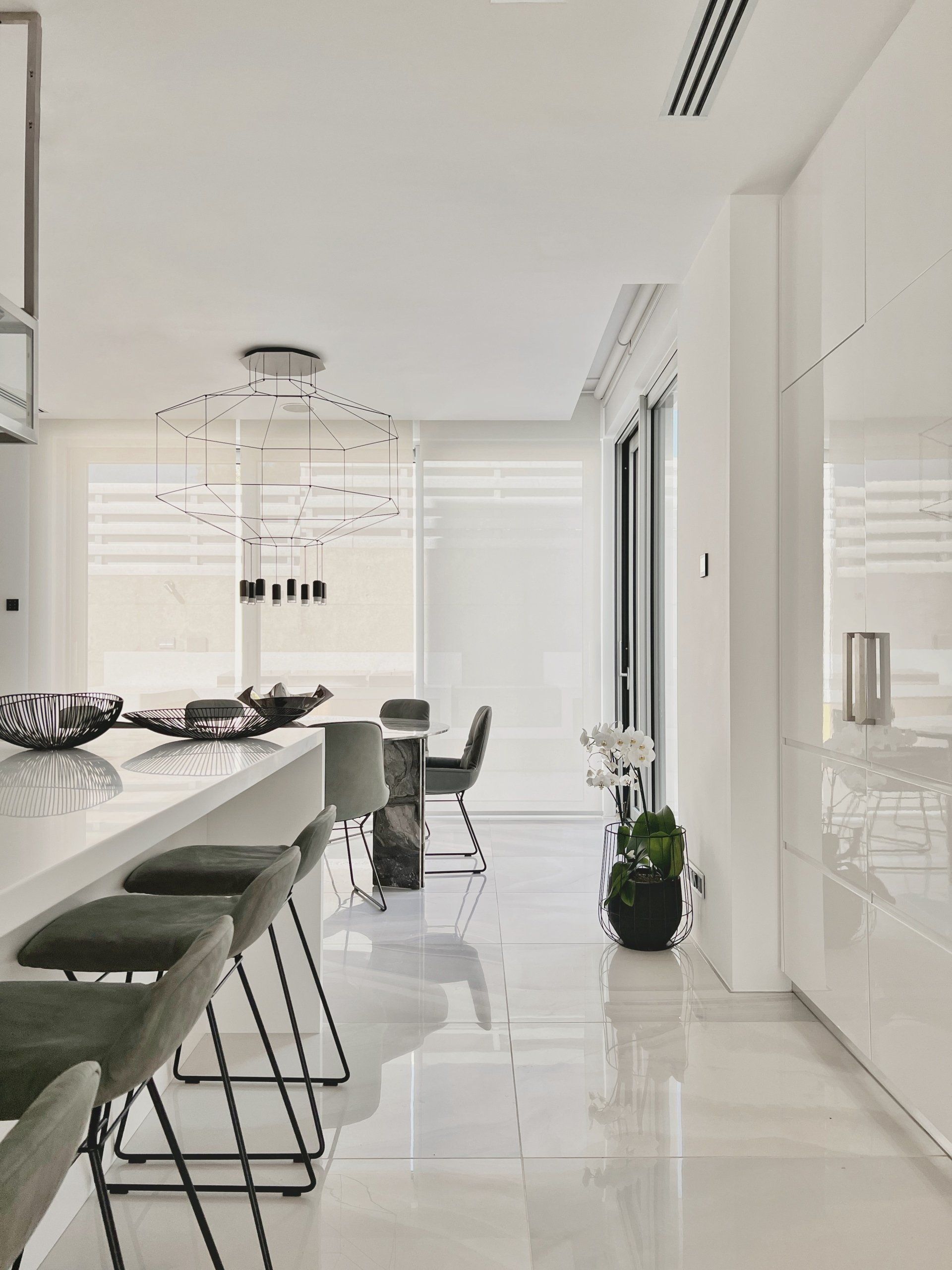 Kitchen area with focus on dining marble table, with view in the gardens