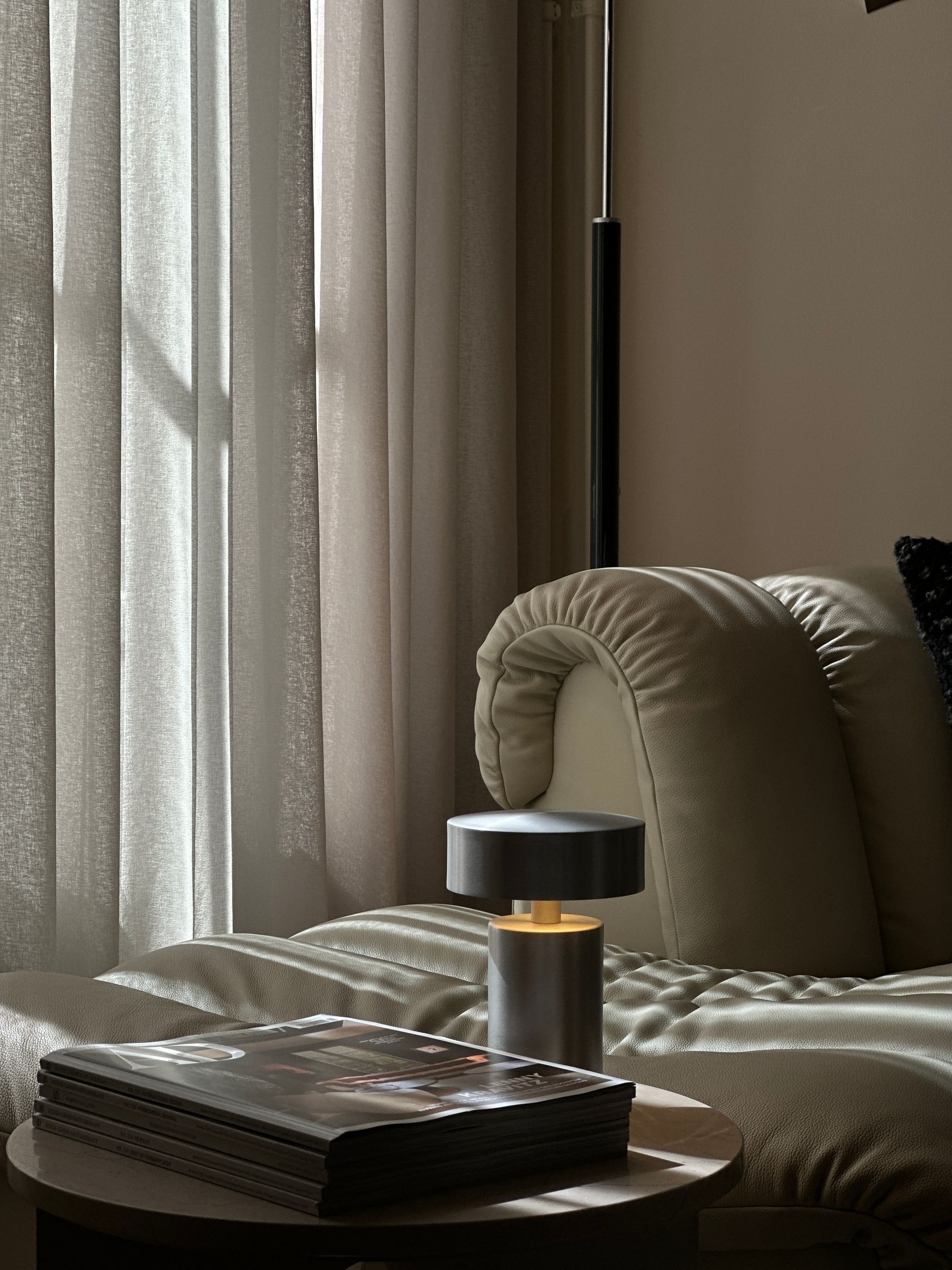 image showing a dining area with luxury materials like marble and leather