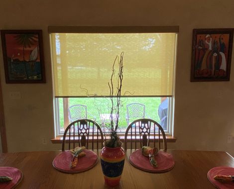 A close up of blue blinds on a window