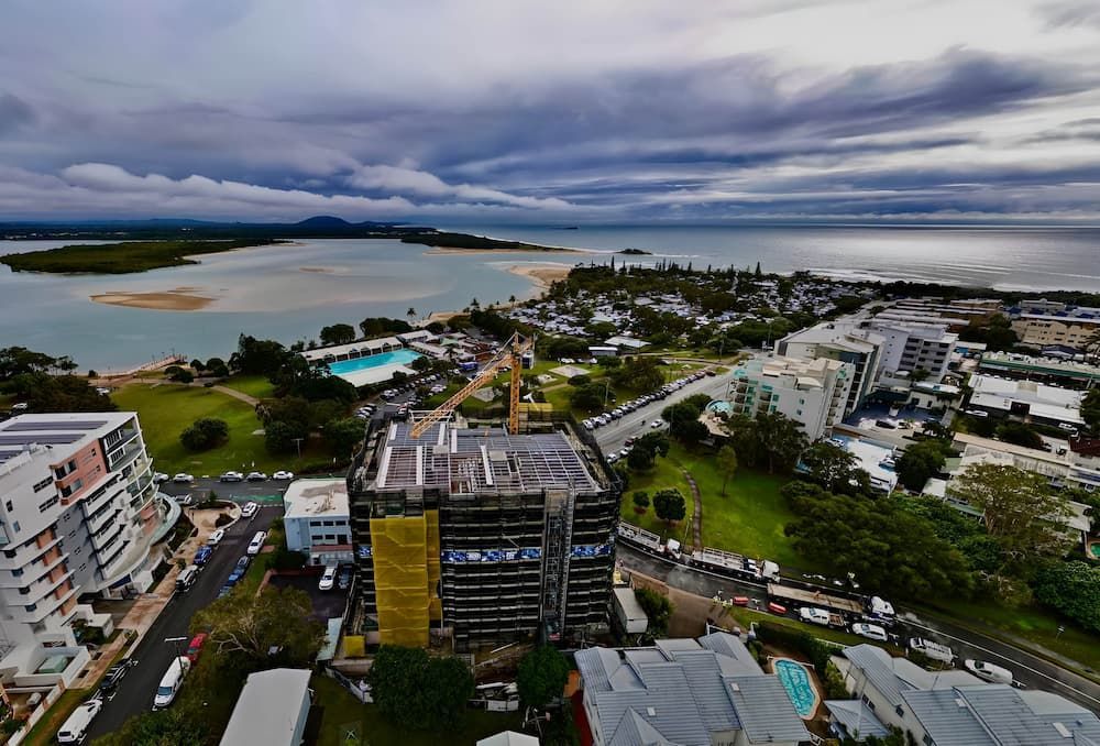 An Aerial View of a City With a Large Body of Water in the Background — All Coast Scaffolding In Yandina, QLD