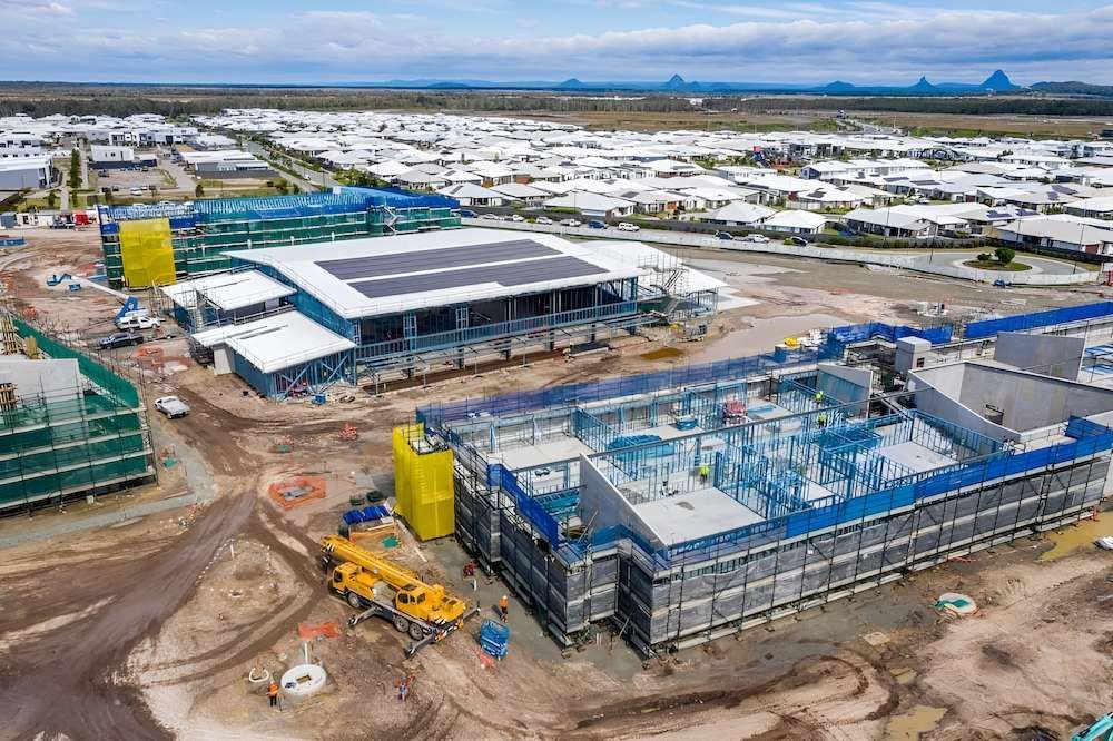 An Aerial View of a Construction Site With a Large Building Under Construction — All Coast Scaffolding In Yandina, QLD