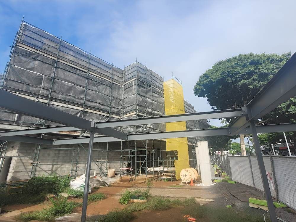 A Large Building is Being Built With Scaffolding Around It — All Coast Scaffolding In Caloundra, QLD