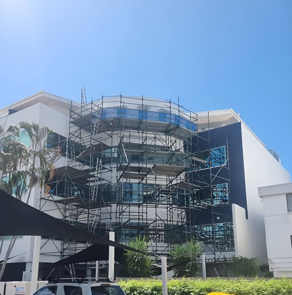 A Large Building With a Lot of Scaffolding Around It — All Coast Scaffolding In Yandina, QLD