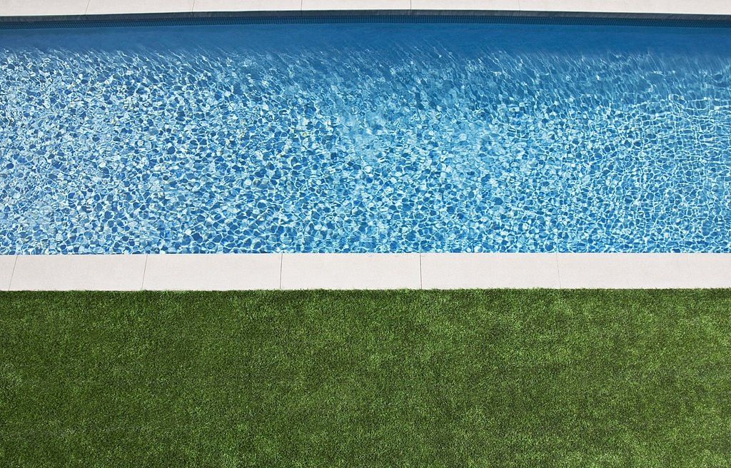 artificial turf installed around the paved pool deck in Paradise Valley AZ
