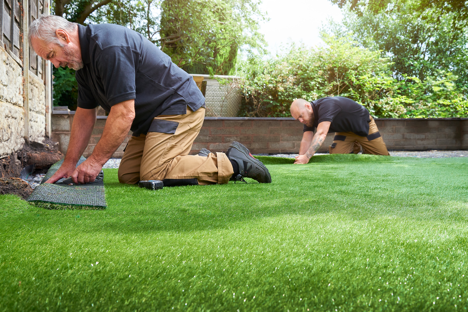 Scottsdale Artificial Turf experts fitting the artificial turf for this property in Scottsdale