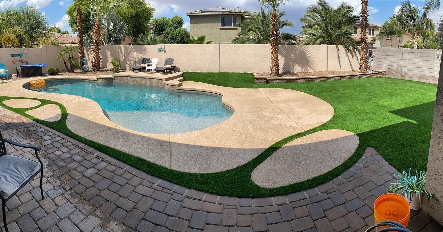 artificial turf installed around the paved pool deck in Tempe, AZ