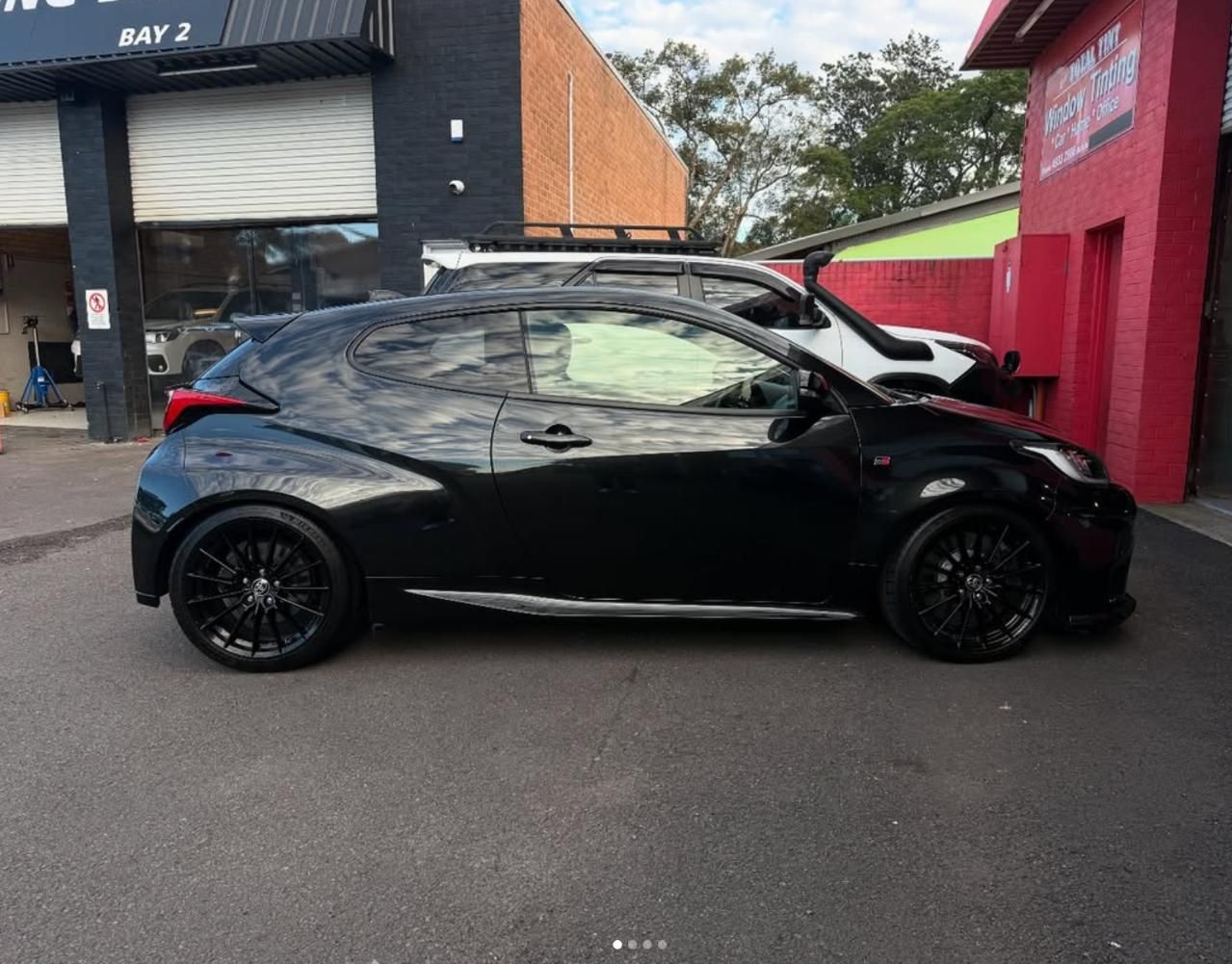 A Black Car Before Applying Window Tint — Rod's Total Tint in Maitland, NSW