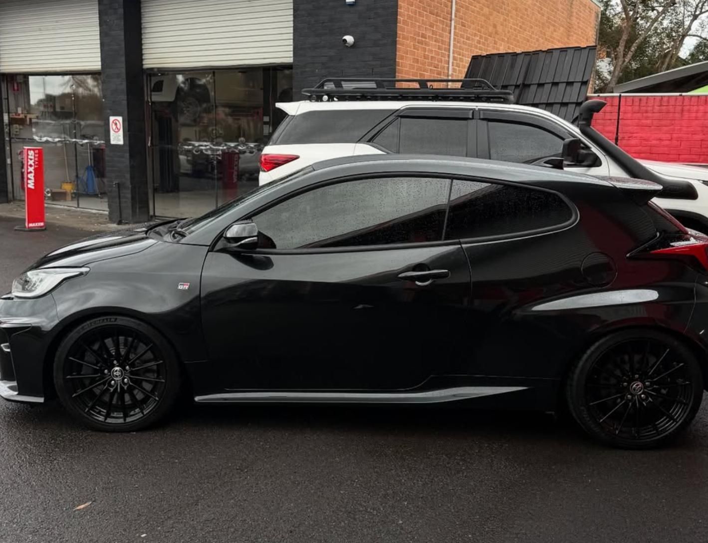 A Black Car After Applying Window Tint — Rod's Total Tint in Maitland, NSW